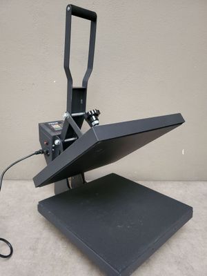 an image of a black heat presser sitting on top of a table