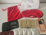 a bag of cosmetics and a pouch of eyeliners on a table