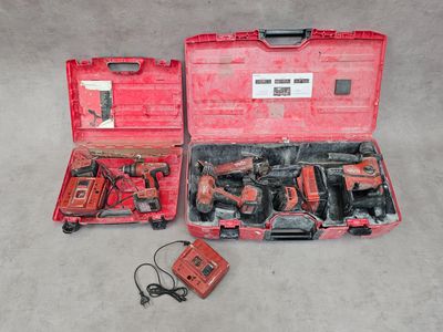 a red tool case with tools in it on the floor