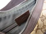 a close up of a purse with a tag on it