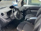 the interior of a car with the door open and the driver ' s seat down