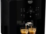 a close up of a coffee machine with two cups of coffee