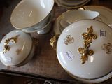 a table with a lot of dishes and cups on it