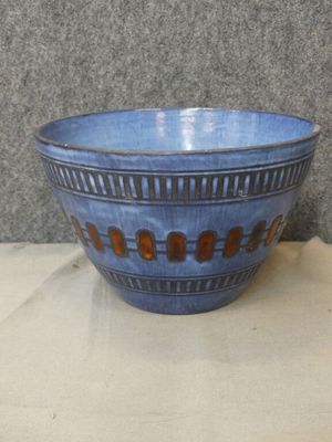 a blue bowl that is sitting on a table
