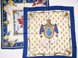 two blue and white handkerchiefs with a picture of a man on a horse