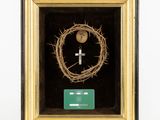 a close up of a cross and a crown of thorns in a frame