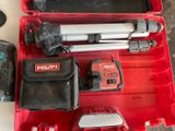 a red tool box with tools in it on a table