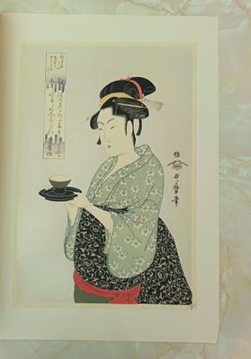 a picture of a woman holding a plate of food