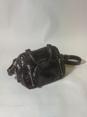 a small black purse on a white background