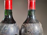 two bottles of wine that have been left on the table