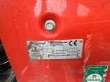 a close up of a sign on a red machine