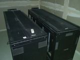 two black boxes that are sitting in a room