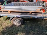 a trailer with a solar panel on the back of it