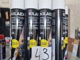 several cans of klax are on a glass table in a store