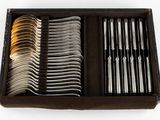 a box of silverware with a variety of forks and spoons