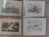de nombreuses photos accrochées au mur d'une salle de bains