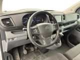 the interior of a car with a steering wheel and dashboard controls