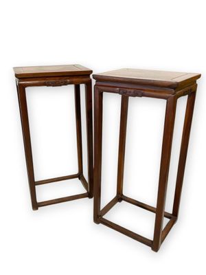 pair of wooden side tables on a white background with a white background