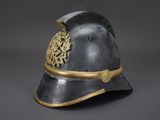 an old helmet with a gold decoration on the side
