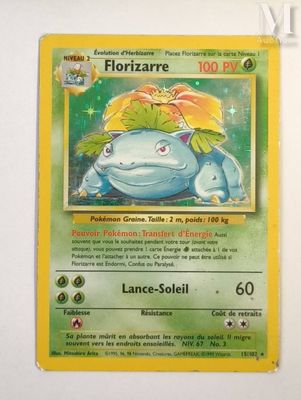 a close up of a pokemon card on a white surface