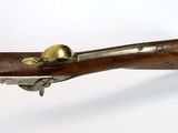 a close up of a rifle on a white background
