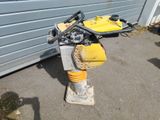 a yellow and black fire hydrant sitting on the ground