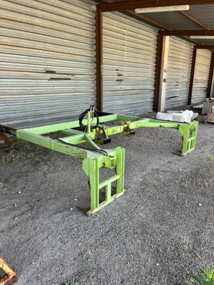 a couple of green tables sitting in front of a building