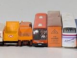 a lot of toy trains that are lined up on the table