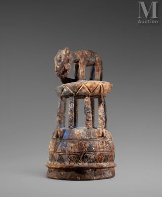 a close up of a statue of a person on a chair