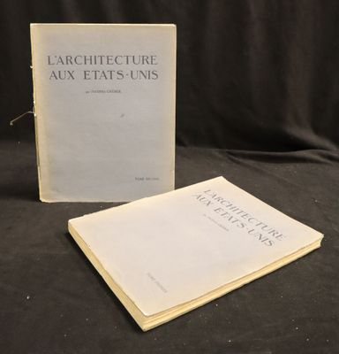 two books on a black cloth with a black background