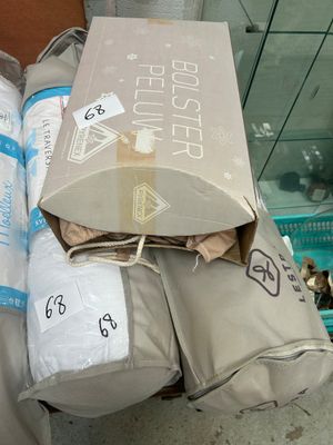 boxes of toilet paper are stacked on top of each other on the floor