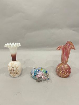 three vases sitting next to each other on a table