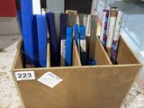 a wooden box filled with assorted items in a store
