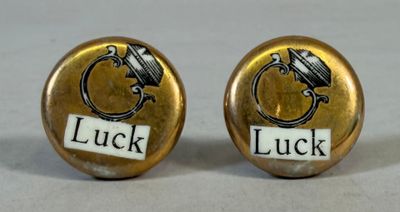 luck and luck cufflinks with the word luck written on them