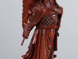 an image of a figurine of a woman with a dragon on her arm