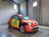 a small car with chinese writing on the side of it