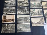 several old black and white photographs of people and buildings on a table