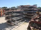 a lot of metal items that are stacked on the ground