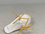 an image of a broken light bulb with pencils sticking out of it