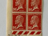 three stamps with a picture of a man and a woman on them