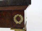 a close up of a wooden table with a clock on it