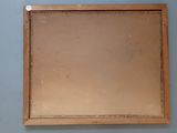 a picture of a mirror hanging on the wall