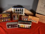 many bottles of wine in a wooden box on a table