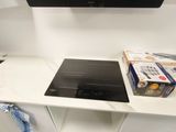 a white entertainment center with a flat screen tv on the wall