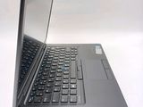 a laptop that is sitting on a white surface
