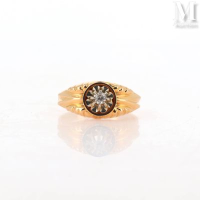 an image of a gold ring with a brown diamond