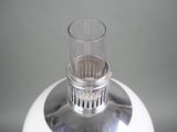 a glass that is sitting on top of a white object
