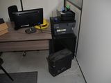 a desk with a computer and a printer on it
