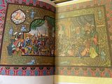 an open book with a picture of a painting on it