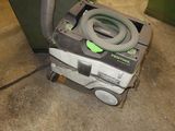 an image of a vacuum cleaner in a garage